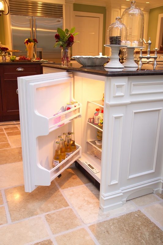 Install a hidden mini fridge in your kitchen island for storing important things like white wine and beer.