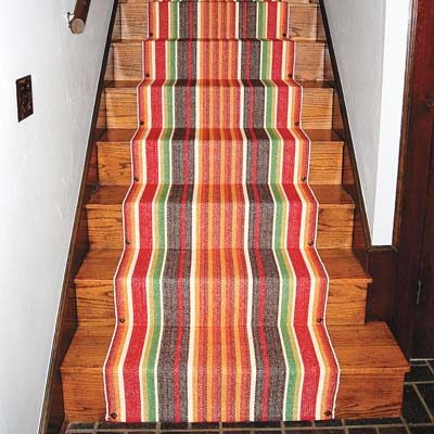 Carpet installation can cost an arm and a leg, so add some flair to your staircase with a <a href="http://www.thisoldhouse.com/toh/how-to/intro/0,,20508662,00.html" target="_blank">DIY runner</a>.