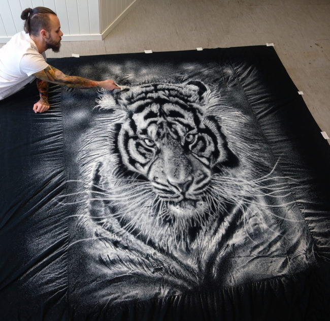 Other artists create similar pieces by drawing with white charcoal on black paper, but Tomic prefers to defy creative conventions.