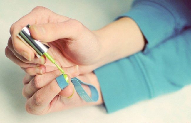 Use a rubber band to give yourself a French manicure.