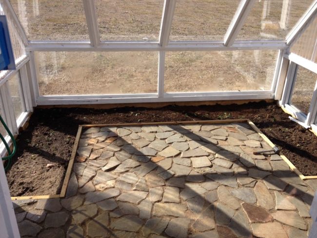 He laid flagstone down to serve as a way of retaining heat in the space.
