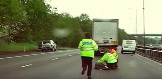 With both women lying in the middle of the road, police have to act fast to stop traffic, attend to the injured women, and then clear the roadway.