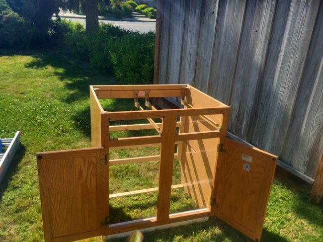 Working with an old cabinet, he began building out his kitchen area.