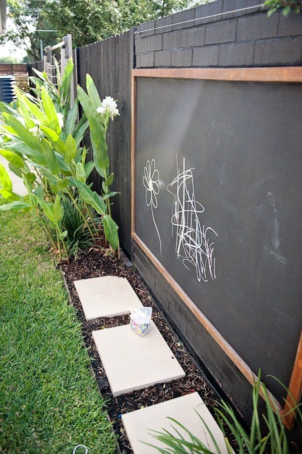 Help the kids add character to your space by installing a chalkboard on the fence!