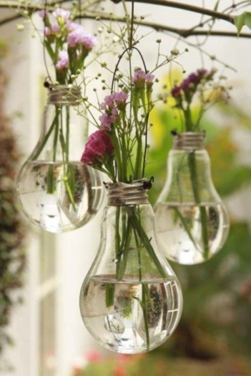 Put your flowers on display in the cutest way possible by <a href="http://www.shelterness.com/cute-diy-light-bulb-vases/" target="_blank">turning lightbulbs</a> into hanging vases.