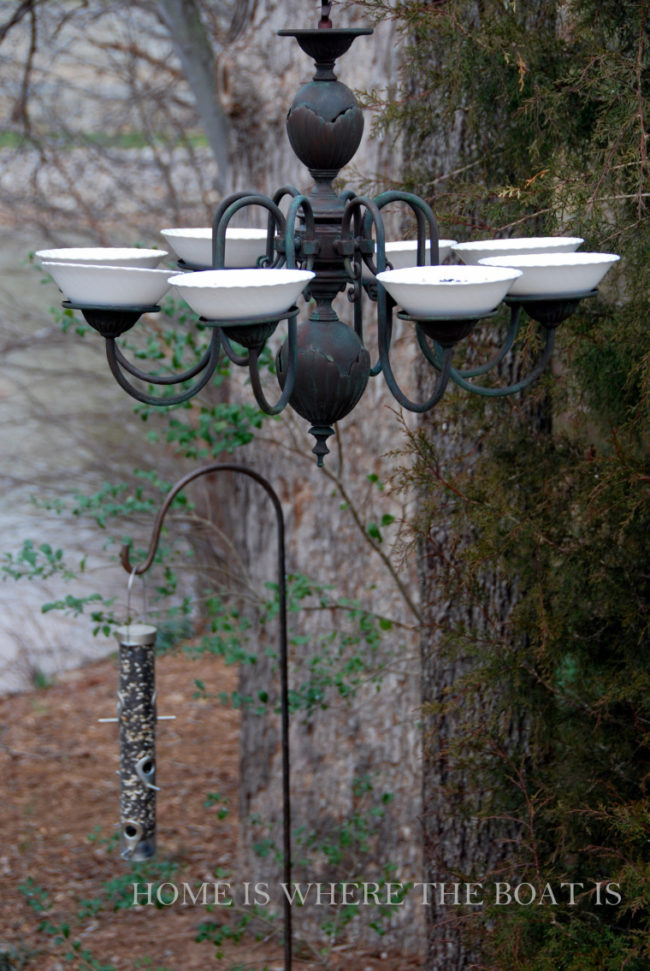 <a href="https://homeiswheretheboatis.net/2013/02/18/for-the-birds-repurposed-chandelier-feeder/" target="_blank">Repurpose</a> an old chandelier by turning it into an elegant bird feeder.