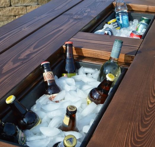 <a href="http://www.remodelaholic.com/build-patio-table-ice-boxes/" target="_blank">Install coolers</a> in your patio table.