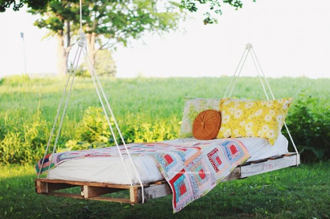 Three words: <a href="http://themerrythought.com/diy/diy-pallet-swing-bed/" target="_blank">pallet swing bed</a>.