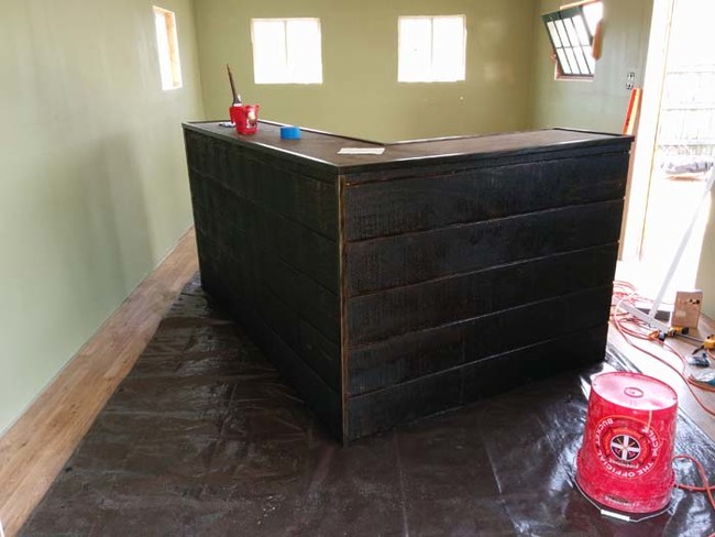 It looks like the bar is finished in this photo, but wait until you see what he did with the countertop. 