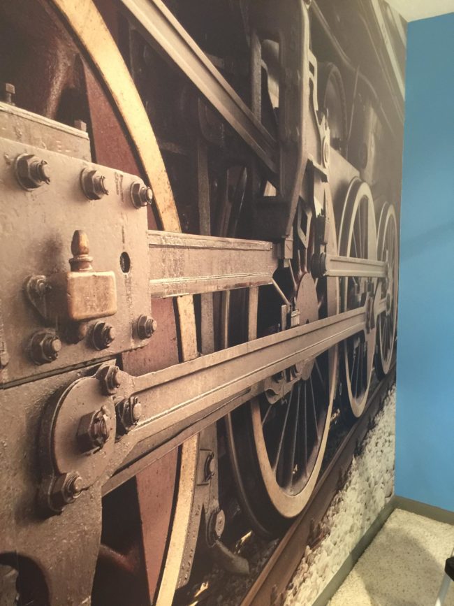 This locomotive mural is the perfect addition to any train lover's paradise.