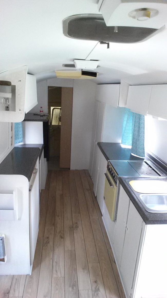 A wine refrigerator was added to the camper and Jomini777 built a spot for a washer/dryer.