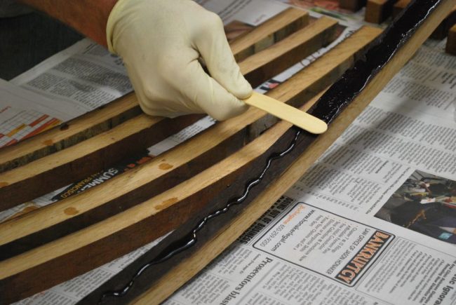 Applying urethane glue to the surface will help close in the gaps between the staves. 