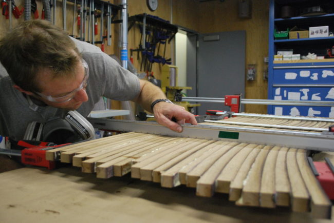 The builder recommends gluing two groupings together at a time to maintain that all the pieces remain flat.