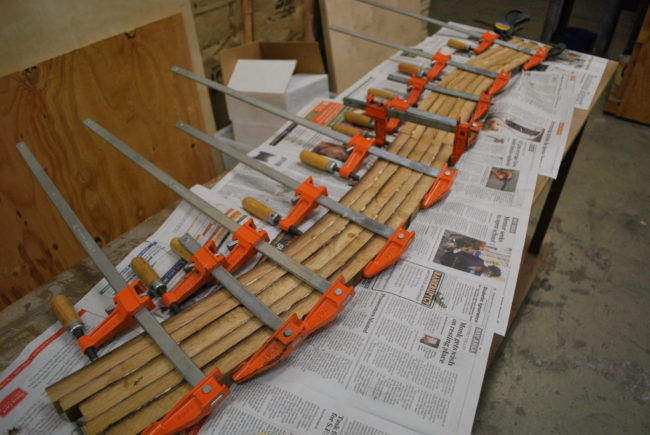 The freshly glued staves will need to be clamped to prevent the middle from cupping or bowing.