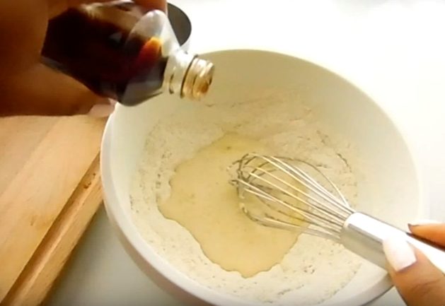 After mixing all the dry donut ingredients together, make a well and add in the wet ingredients. Stir until well combined.