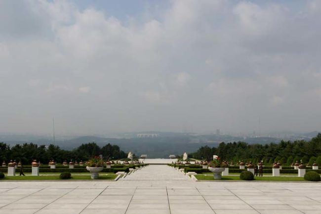 This picture was taken at Taesongsan Revolutionary Martyrs' Cemetery, which is on the top of a mountain facing the country's capital city of Pyongyang.