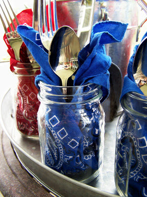 If you're having a slightly more formal affair, make these <a href="http://asoftplace.net/2009/06/for-the-love-of-mason-jars/" target="_blank">cute place settings</a> with Mason jars and patriotic bandanas. The jars can be used for drinks later. You're welcome.