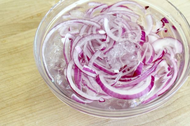 Soaking onions in a bowl of ice water can eliminate the stench without sacrificing the taste!