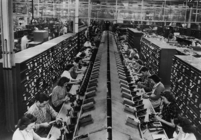These women are assembling control units for tanks and aircraft in one U.S. factory during the height of WWII.