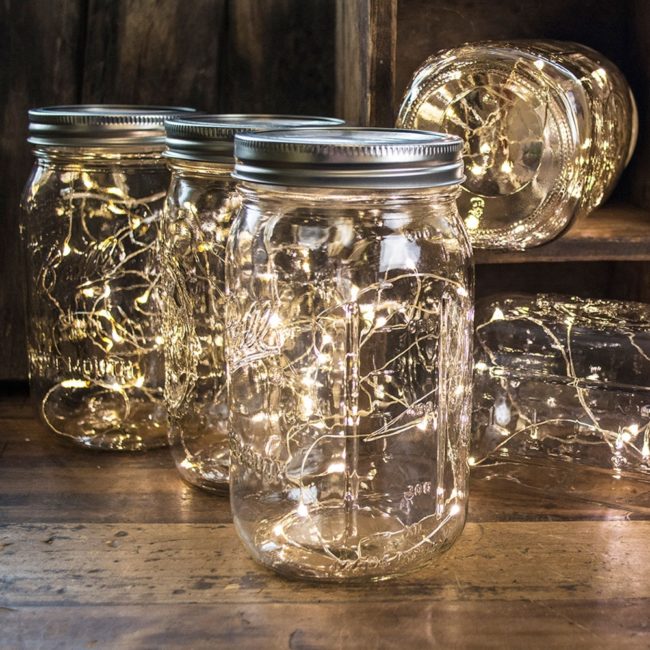 No tutorial necessary for this simple, elegant design. Just grab yourself a Mason jar and some <a href="https://www.amazon.com/Batteries-Required-Included-Centerpiece-Decorations/dp/B01COK5IFA/ref=sr_1_1?ie=UTF8&amp;qid=1467754657&amp;sr=8-1&amp;keywords=led+battery+fairy+lights" target="_blank">battery-operated fairy lights</a>!