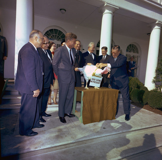 U.S. President John F. Kennedy receives the annual White House Thanksgiving turkey from the National Turkey Federation, just three days before his assassination in Dallas.