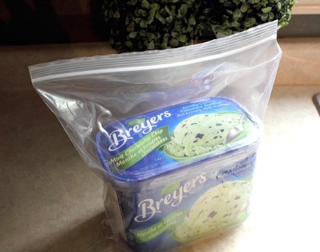 Keep your ice cream at the perfect consistency (not too hard or soft) in the freezer by placing it in a plastic bag.