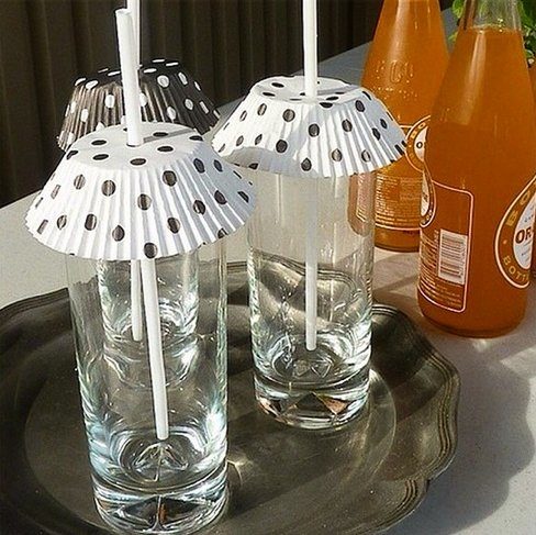 Poke straws through cupcake papers and pop them on top of glasses to keep bugs out of your drinks.