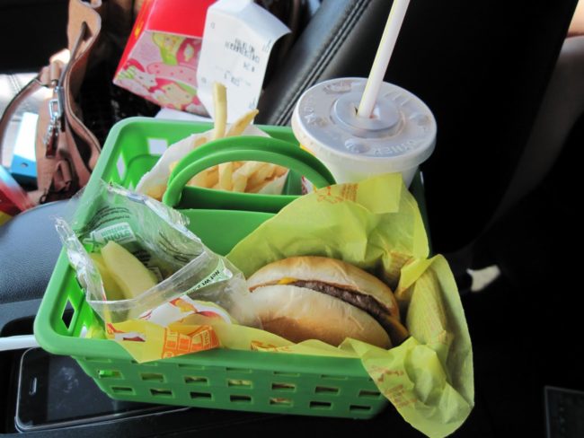 Use a shower caddy to organize meals in the car on road trips.