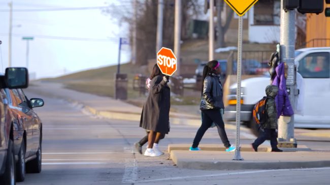 She even serves as a crossing guard when students arrive.