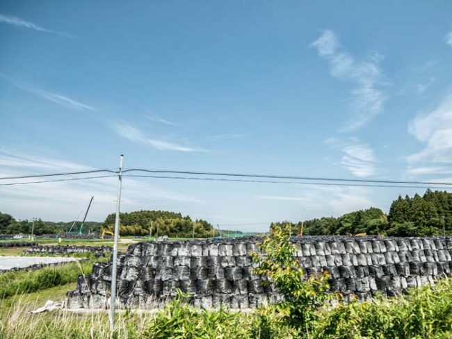 These are bags of radioactive soil and rocks. Piles of radioactive waste can be seen all over town.