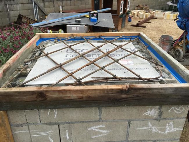 The counter where the pizza oven would rest was crafted with more cement and rebar.