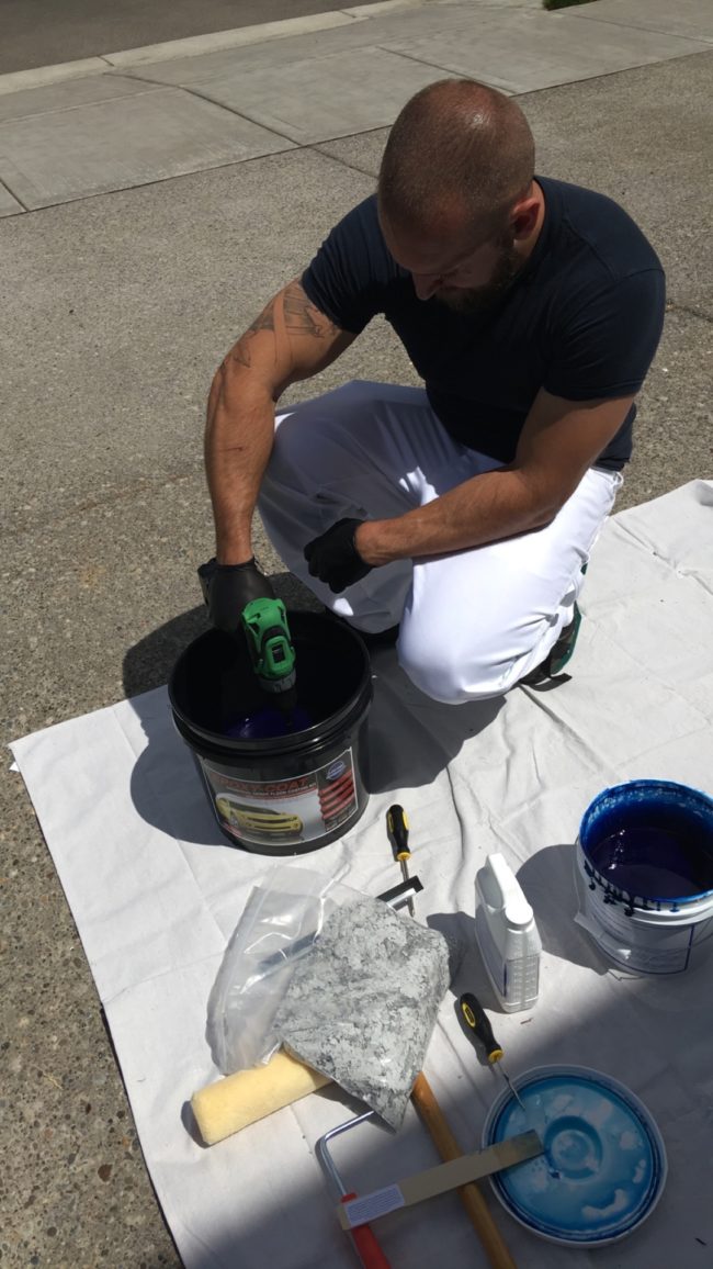 He grabbed a drill mixer and got the ball rolling with some blue epoxy.