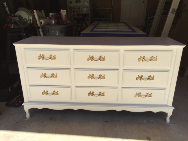 She reattached the handles and put the drawers back in the dresser.