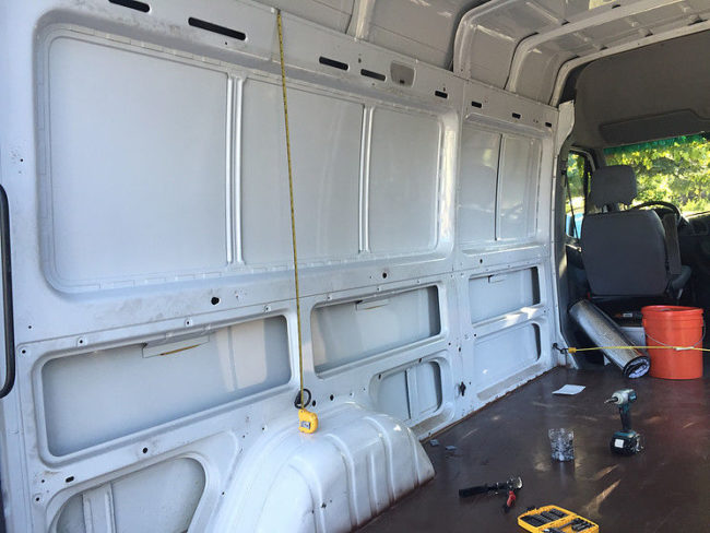 He found a professional to insulate the inside of the van. The catch? He had to complete all the prep work himself.