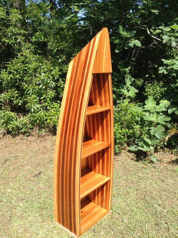 Get the nautical vibes going with this <a href="https://www.etsy.com/listing/232703111/handcrafted-5ft-cherry-and-mahogany-boat?ga_order=most_relevant&amp;ga_search_type=all&amp;ga_view_type=gallery&amp;ga_search_query=bookshelf&amp;ref=sr_gallery_39" target="_blank">canoe design</a>.