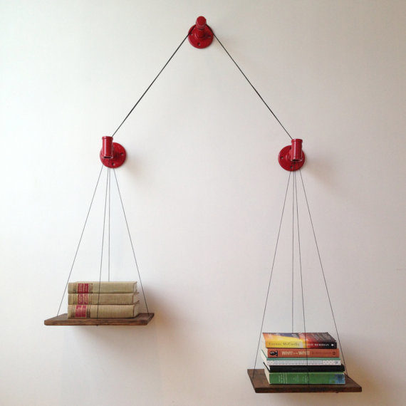 Is <a href="https://www.etsy.com/listing/124700491/red-balance-bookshelf?ga_order=most_relevant&amp;ga_search_type=all&amp;ga_view_type=gallery&amp;ga_search_query=bookshelf&amp;ref=sc_gallery_3&amp;plkey=1ba1e907127ac5e7b49df75bf34afa84cdf69982:124700491" target="_blank">this</a> the most practical setup? No. Is it the coolest? YUP.