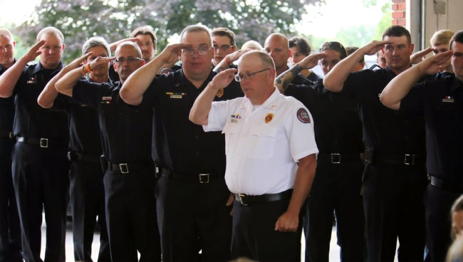 After the National Anthem and a few heartwarming speeches, Brian was presented with a full firefighter's uniform, as well as other gifts from the mayor, state representatives, and various local sports teams.