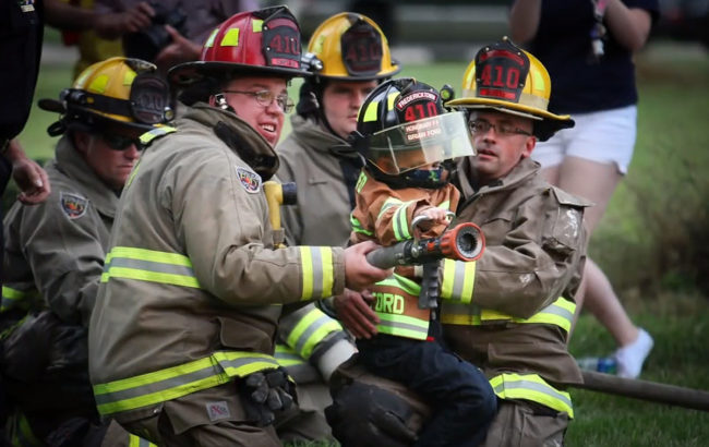 They then set it on fire so the brave honorary firefighter could get a turn at holding the nozzle. He saved the day!