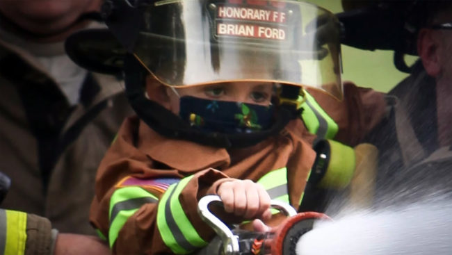 Even though Brian was in pain and wearing a mask to protect the sores on his face from being exposed to bacteria, firefighter Jason Bostic told reporters that the little guy turned to him and said, "Can you see it? Can you see me smiling?"