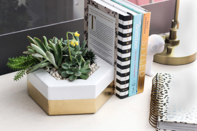 This beautiful <a target="_blank" href="http://jenwoodhouse.com/2x4-building-challenge/">hexagon planter</a> also serves as a bookend.