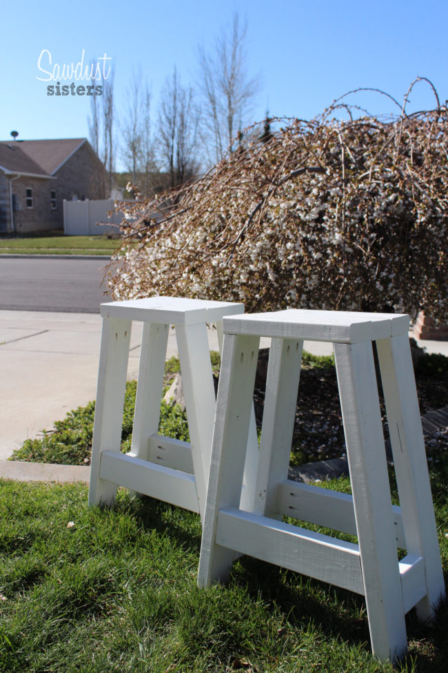 These <a target="_blank" href="https://sawdustsisters.com/diy-barstool-using-only-2x4s/">barstools</a> would work inside or outside as cute plant stands.