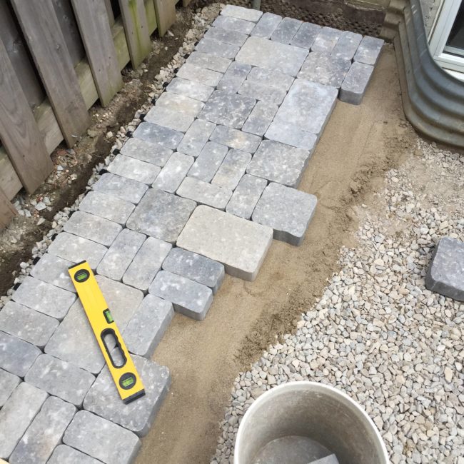Laying down paving stones in different shapes and sizes added a bit of interest.