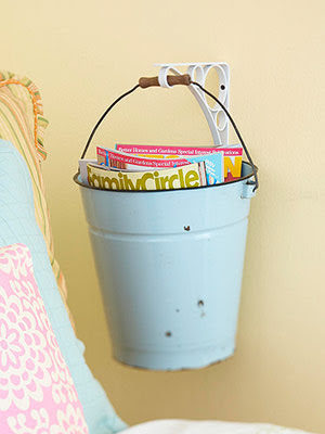 Transform old buckets into <a href="http://coisasdaorlas.blogspot.com/2010/08/inspiracao.html" target="_blank">unconventional coloring book holders</a>.