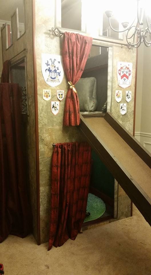 The last step was to personalize it with handmade curtains and their family crests. It looks amazing!