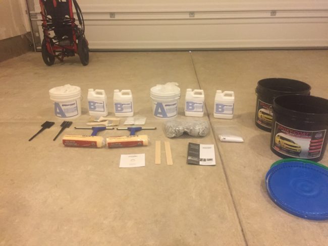 Before starting, he gathered up two drill mixers, blue and clear epoxy, paintbrushes, squeegees, paint rollers, mixing sticks, two buckets, flakes for detail work, and some non-skid aluminum oxide.