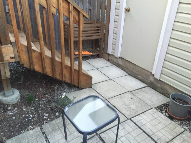 This is the patio before. Mismatched slabs. Wasted space. Not exactly a dream come true.