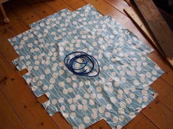 After that, it was time to find a liner for the sandbox. This tablecloth did the trick!