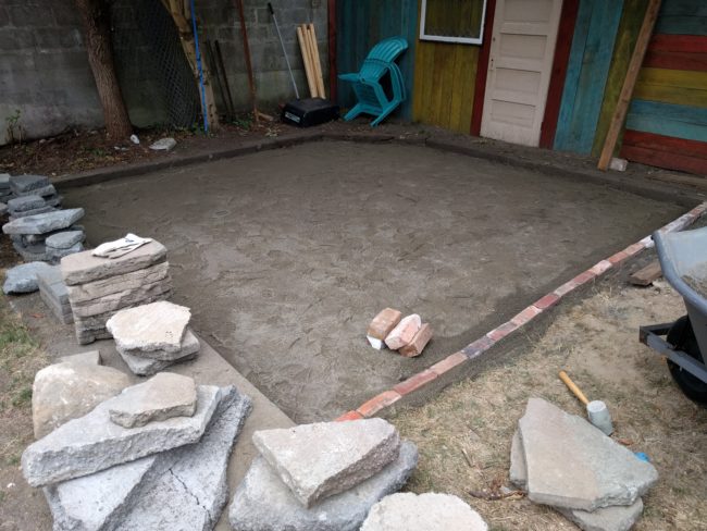 Our builder used a combination of railroad ties and bricks to create a border for the patio.