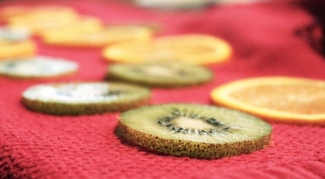 She makes sure that the slices run perpendicular to the grain.