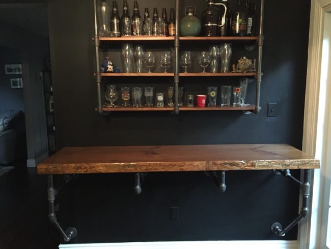 For the last step, he used drywall screws to attach the bar to the wall. It looks so cool!